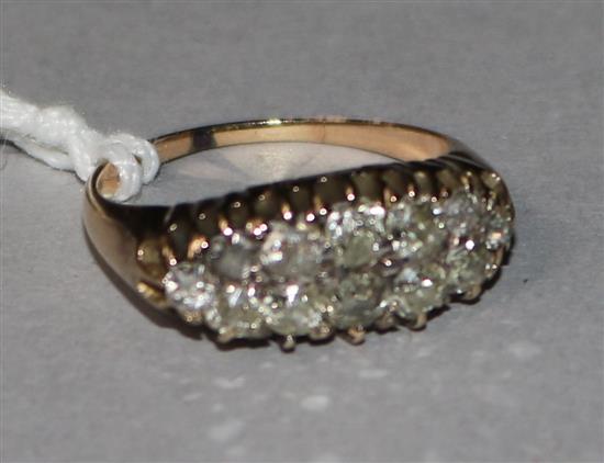 A gold and diamond cluster half hoop dress ring, size M.